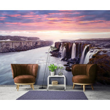 Een fotobehang van een waterval tijdens de zonsondergang met uitzicht voor de huiskamer.