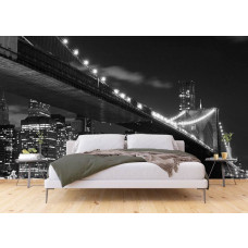 Een fotobehang van de Brooklyn Bridge bij nacht in New York voor de slaapkamer.