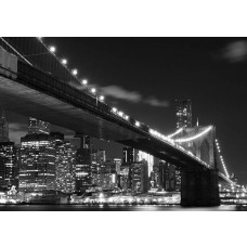 Een fotobehang van de Brooklyn Bridge bij nacht in New York.