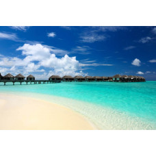 Fotobehang van de prachtige stranden van de Malediven, met helderblauw water en witte zandstranden.